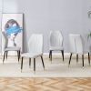 4 light gray modern dining chairs with stylish PU patterned backrest and black metal legs for a comfortable home experience in the kitchen